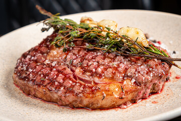 grilled steak with herbs and garlic