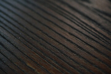 Obraz premium Dark brown solid wood texture for ethnic themed text background. 