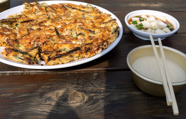 Table set with makgeolli and seafood pajeon