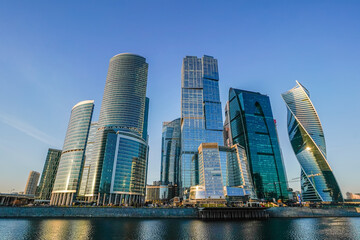 Fototapeta na wymiar Skyscrapers in the business center, financial district, sunny day, blue sky, empty space, Moscow city, Russia.