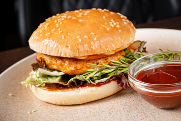 burger with sauce on plate