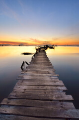 Naklejka na ściany i meble Sunrise scenery of a wooden jetty 