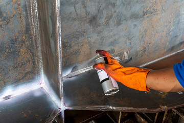 Step to use developer spray into the welded to pull the liquid penetrate from the defect for...