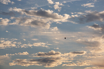hot air balloon in the clouds in the sky