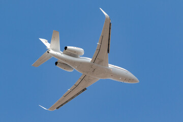 Airplane taking off in the blue sky - bizjet