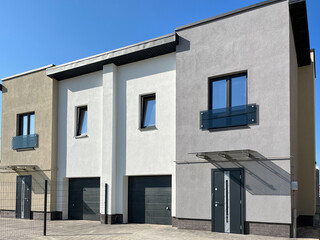 Exterior view of a modern townhouse. The concept of outdoor buildings of multi-apartment residential townhouses