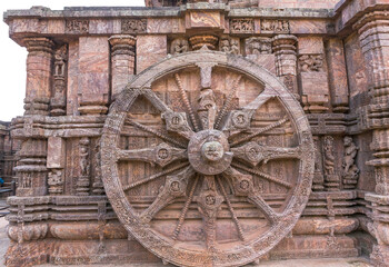 A stone wheel engraved in the walls of the 800 year old Sun Temple, Konark, India. The temple is...