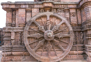 A stone wheel engraved in the walls of the 800 year old Sun Temple, Konark, India. The temple is designed as a chariot consisting of 24 such wheels.