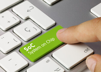 SoC System on Chip - Inscription on Green Keyboard Key.