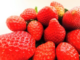 red background formed by a group of strawberries ,healthy 