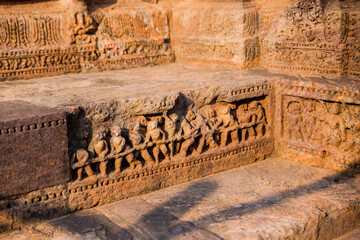 Figures of Men at work at the ancient 800-year-old temple dedicated to Sun, Konark, Orissa, India....