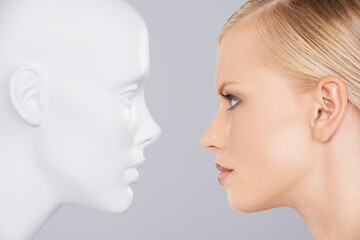 Face your problems. Close up of a woman looking at a dummy.