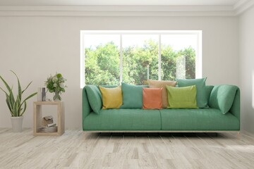 Fototapeta premium Stylish room in white color with sofa and summer landscape in window. Scandinavian interior design. 3D illustration