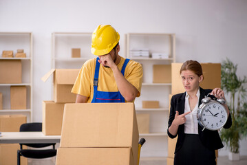 Young female boss and male contractor doing home relocation in t