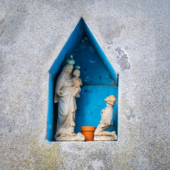 Old Christian votive shrinein a village over the hills of Oltrepo Pavese (Lombardy, Northern Italy); this area is world famous for its valuable red and sparkling white wines.
