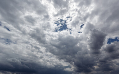 The dark sky with heavy clouds converging and a violent storm before the rain.Bad or moody weather...