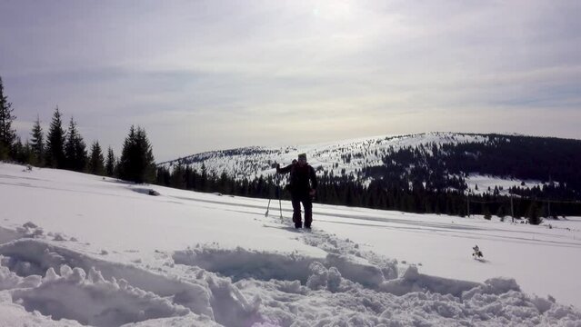 Hiker Searching For Cell Phone Signal In The Winter Forest Mountain Remote Area
