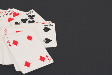 playing cards on a black background.