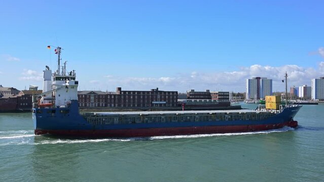 A large German registered cargo ship arriving in Portsmouth Harbour from Hamburg with Gosport in the background.