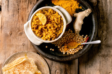 Traditional indian yellow pea food dal with roti bread