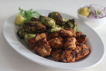 Green and red chicken kababs. Boneless chicken cubes marinated and air fried