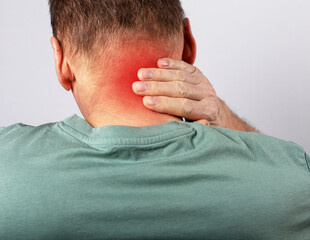 Neck pain or injury. Man hand holding neck. Muscle spasm. Health problems and medicine concept. High quality photo