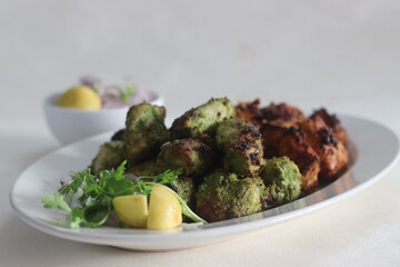 Green and red chicken kababs. Boneless chicken cubes marinated and air fried