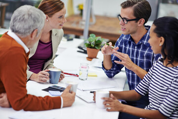 He always communicates his ideas well. A cropped shot of a group of professionals having a meeting at work.