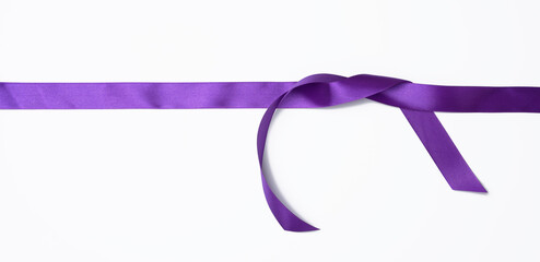 purple silk ribbon tied on white background, decor