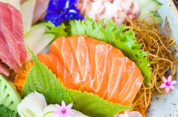 Platter decorated with different flavors of elegant sushi.