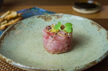 Delicious tuna tartar on a beautifully decorated plate.