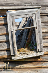 Obraz premium windows of destroyed wooden houses
