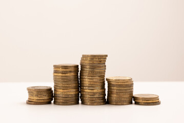 coins stacked on a white background. Money saving concept