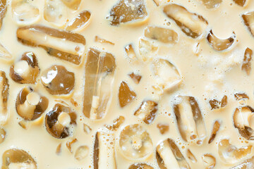 Coffee and ice texture,Close-up of Cold latte drink with ice cubes,
