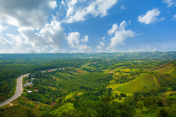 Fototapeta premium aerial view of roads and mountains,view of curve road through green forest and mountain rural scene north of Thailand