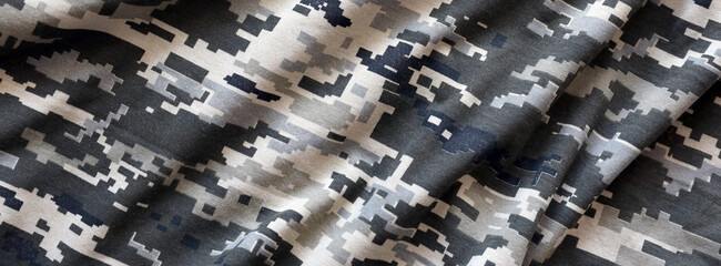 Fabric with texture of Ukrainian military pixeled camouflage. Cloth with camo pattern in grey,...
