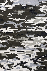 Fabric with texture of Ukrainian military pixeled camouflage. Cloth with camo pattern in grey,...