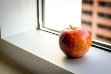 apple on window sill