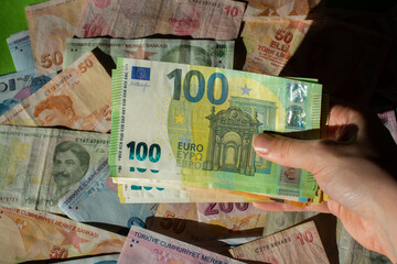 Euro, currency of European Union and Turkish Lira Financial background.