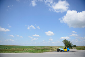 Fototapeta premium Destroyed vehicle in the field of Ukraine