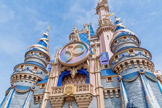 Cinderella Castle in the new pink and blue paint, with 50th medallion