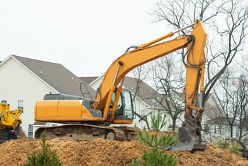 Excavator in the construction debris clean up site