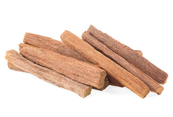 Pile of sandalwood sticks isolated on a white background. Chandan or sandalwood.