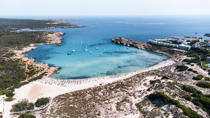Aerial view of sand beach in summer with boats mooring
