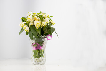 flowers in a vase of snowdrops