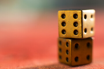 Dice on red background, selective focus.