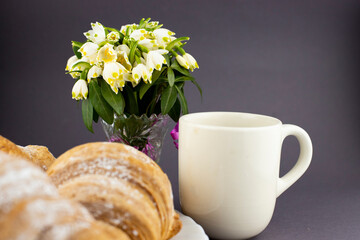 breakfast morning coffee with snowdrop flowers