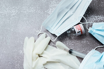 Medical waste from vaccinations, medical gloves, syringes, masks.