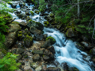 Fototapeta premium mountain waterfall. Waterfall. Running water. Stones in the water 