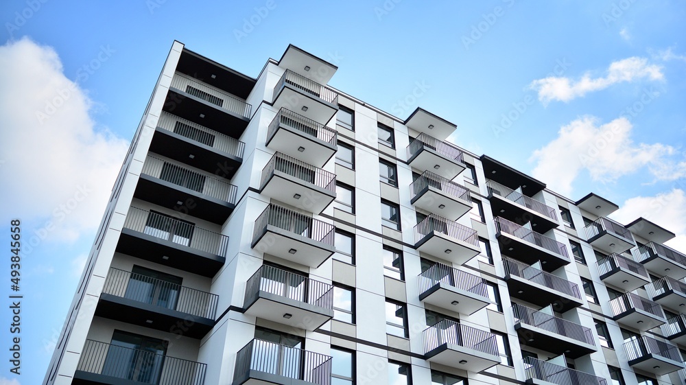 Wall mural modern european residential architecture on a sunny day. exterior of new multi-story residential bui